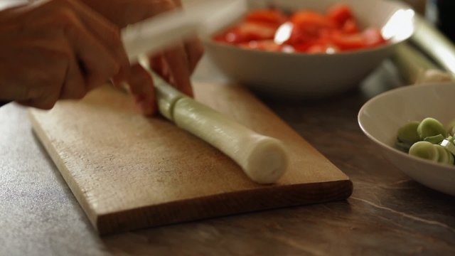 Chef chopping leek - closeup