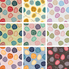 Seamless patterns with abstract flowers in different colors.