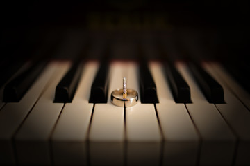 Fototapeta na wymiar Rings on piano
