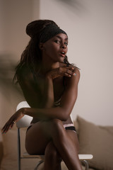 Naklejka premium Beautiful alluring african woman in sexy lingerie