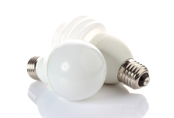 fluorescent and LED bulbs on white background.