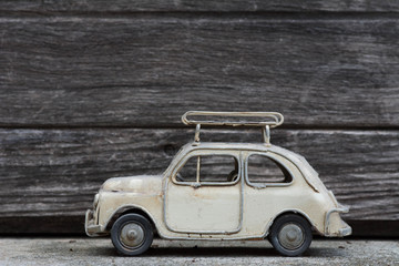 RETRO Classic Car Model with Old Wood Background