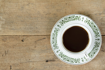 Coffee on wooden plank background