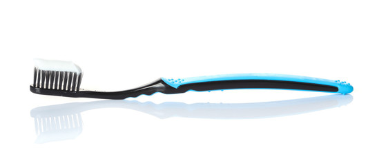 toothpaste on a toothbrush isolated on a white background