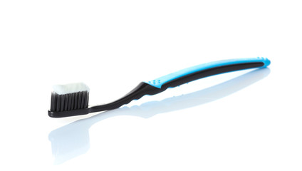 toothpaste on a toothbrush isolated on a white background