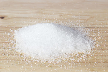Sugar on wood background