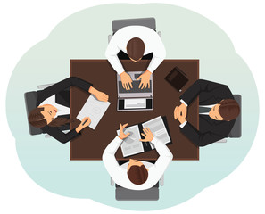 Group of business people discussing at the desk. Top view.