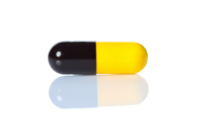 Opened pill with medicine powder