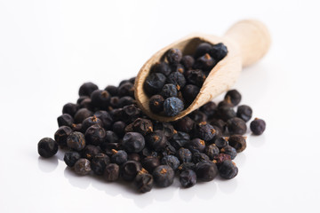 Juniper berries on white background