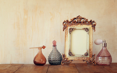 Image of victorian classical frame and perfume bottels