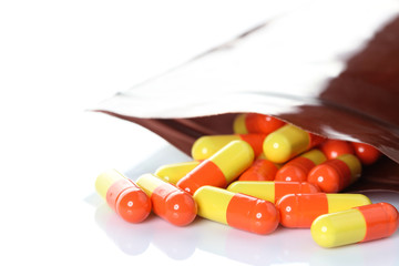 Opened pill with medicine powder