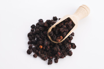 Dried schisandra chinensis fruits isolated on white background