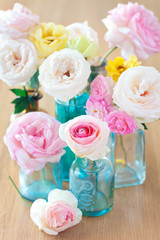 Obraz na płótnie Canvas Floral composition with a roses on a table. 