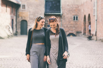Fototapeta na wymiar Two beautiful nordic girls visiting old fortress in Oslo