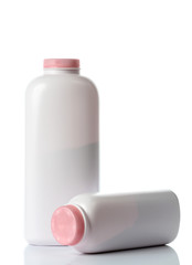  plastic bottles of body care and beauty products on white