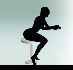 Fototapeta na wymiar woman silhouette with sitting pose leaning on table