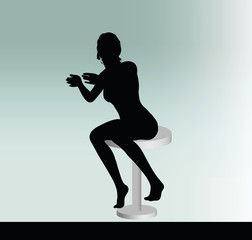 woman silhouette with sitting pose leaning on table