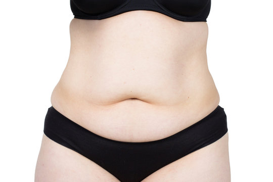 Obese neglected body isolated over white background.
Woman showing her fat body. Healthy lifestyles concept.