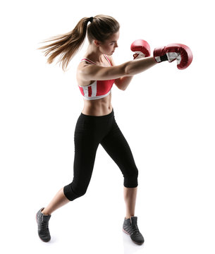  Boxer girl during boxing exercise making direct hit with glove