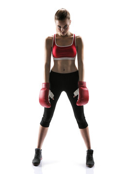  Ready to attack girl wearing sport clothes and boxing gloves