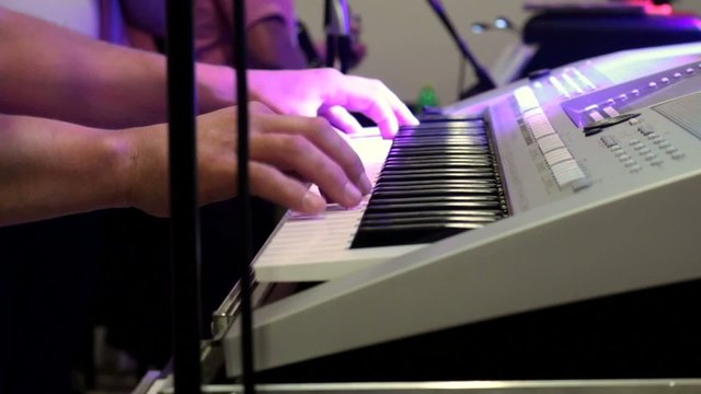 Musician playing the keyboard at the party