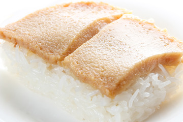 Thai custard with sticky rice on white