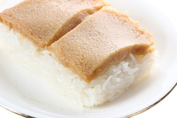 Thai custard with sticky rice on white