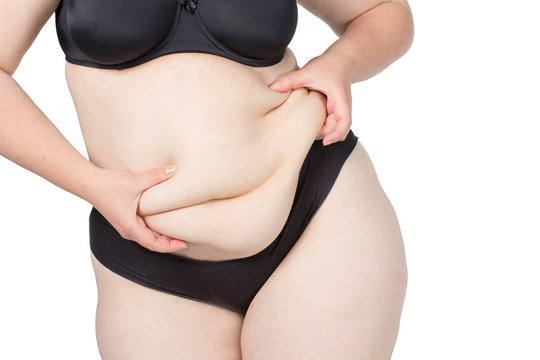 Obese neglected body isolated over white background.
Woman showing her fat body. Healthy lifestyles concept.