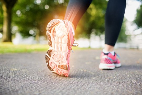 Highlighted foot bones of jogging woman