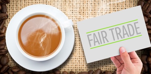 Composite image of hand showing card