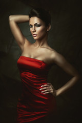 Fototapeta premium beautiful brunette woman in red dress