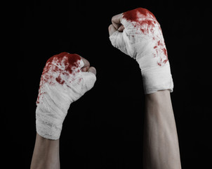 bloody hand in a bandage, bloody bandage, black background