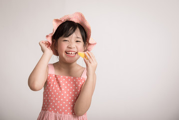 Happy asian girl hand holding melon