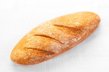 Baked bread on white wooden table