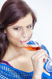 portrait of young woman drinking rose wine