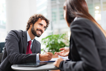 Couple of  working business people