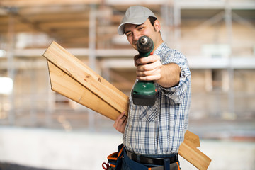 Portrait of a carpenter in a construction site