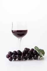 Red wine and grapes