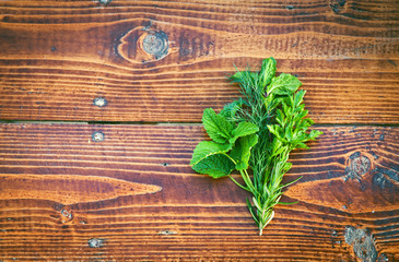 Herbs on wooden table. Seasoning concept