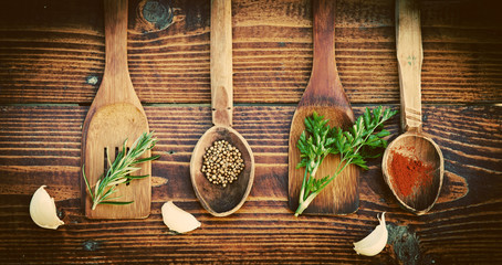 Spices and herbs on wooden table. Top view