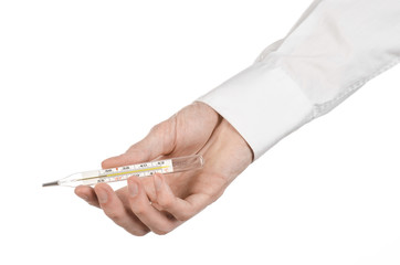 doctor's hand holding a thermometer to measure the temperature