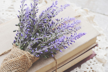 Decoration with lavender bunch upon vintage books bundle - Powered by Adobe