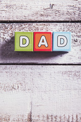 Fathers day composition. Studio shot on wooden background.
