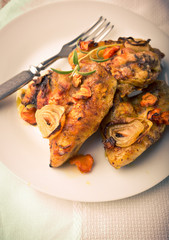 Vintage photo of oven-baked chicken wings with vegetables