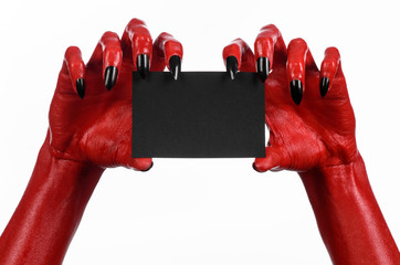 Red devil hand with black nails holding a blank black card - 83517949