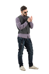 Stylish cool hipster lighting up cigarette