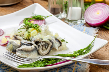Tasty herring in pieces.