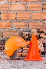 construction helmet safety and cone in construction site