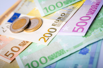 Closeup of euro banknotes and coins