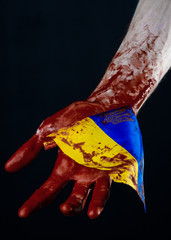 Bloody hands, the flag of Ukraine in the blood, revolution